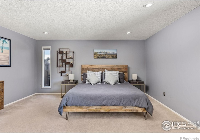 bedroom with baseboards, carpet flooring, and recessed lighting