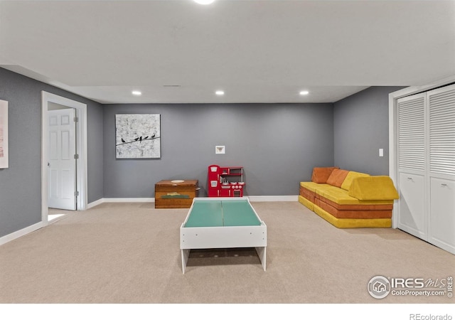 game room featuring recessed lighting, light carpet, and baseboards