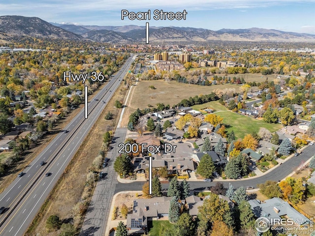 drone / aerial view with a residential view and a mountain view