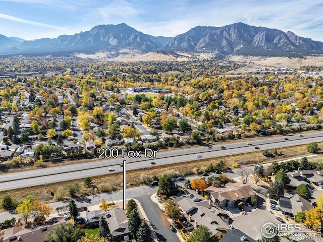 birds eye view of property with a residential view and a mountain view