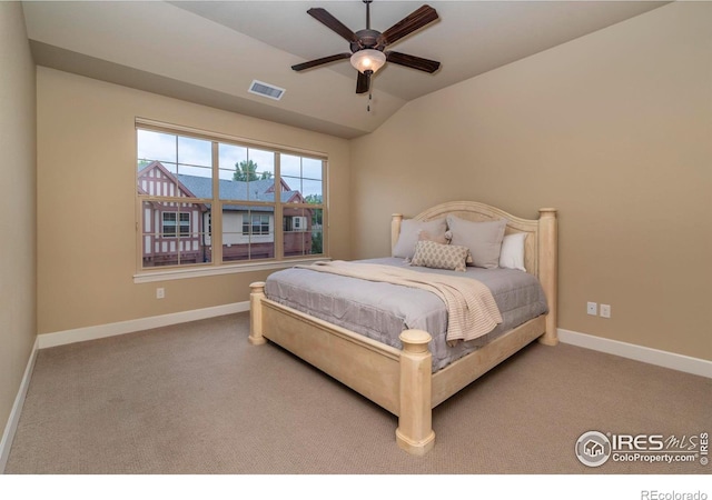 bedroom with vaulted ceiling, carpet, and ceiling fan