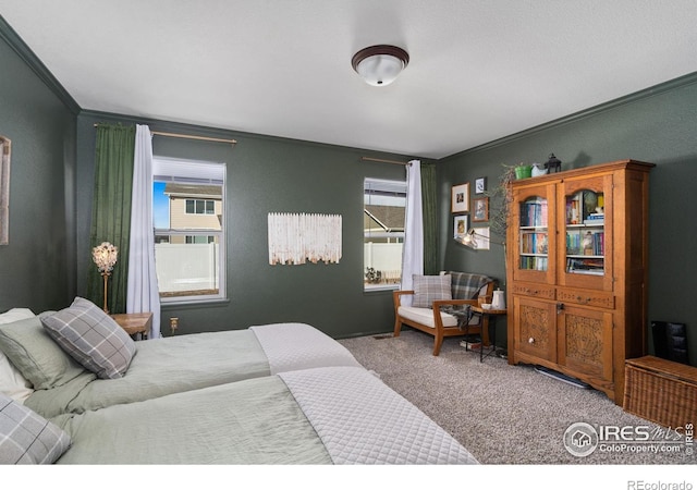 bedroom with multiple windows, crown molding, and carpet