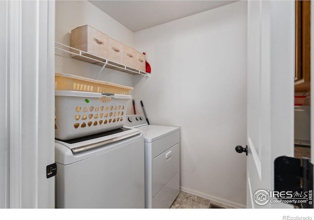 clothes washing area with washer and dryer