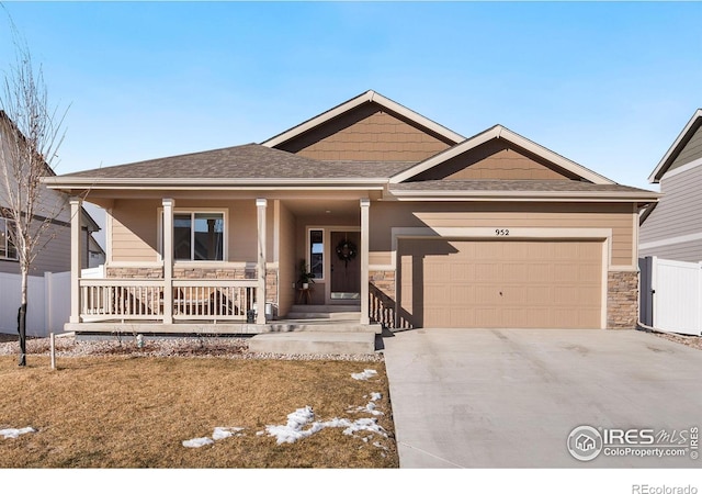 view of front of home featuring a garage and covered porch