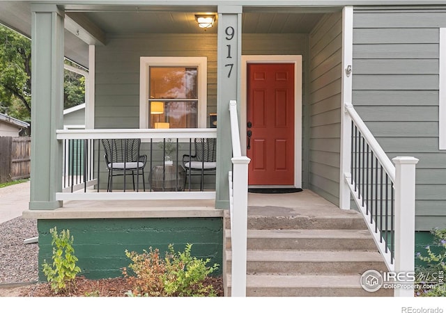 doorway to property featuring covered porch