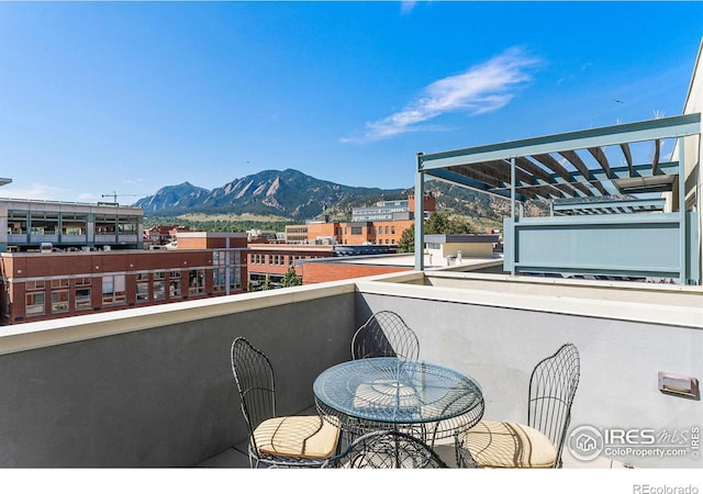 balcony featuring a mountain view