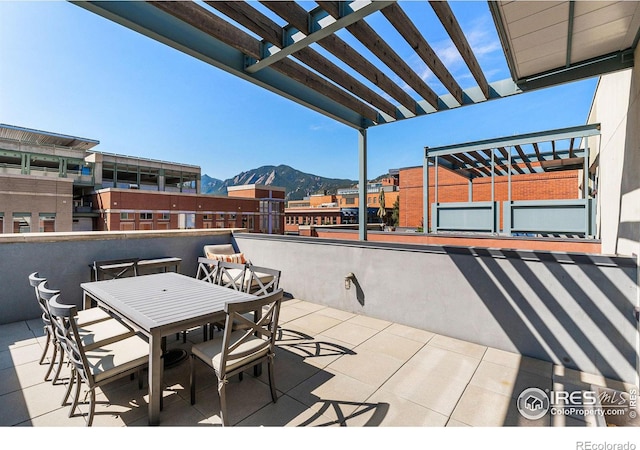 view of patio featuring a mountain view and a pergola