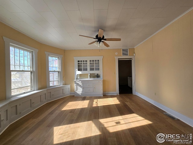 unfurnished living room featuring hardwood / wood-style flooring and ceiling fan