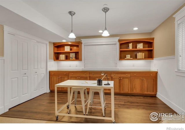 kitchen featuring dark hardwood / wood-style floors and decorative light fixtures