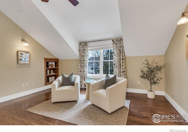 living room with dark wood-type flooring, ceiling fan, and lofted ceiling