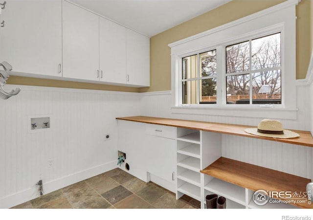 laundry area featuring cabinets, washer hookup, and electric dryer hookup