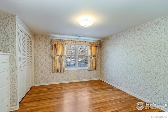 spare room featuring hardwood / wood-style floors