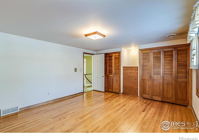 unfurnished bedroom featuring light hardwood / wood-style floors