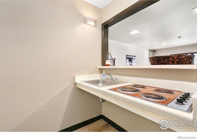 kitchen with cooktop and sink