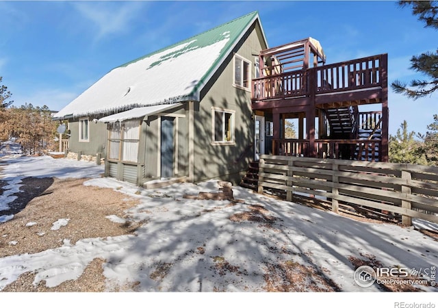 view of front of property with a wooden deck