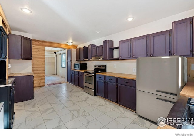 kitchen featuring dark brown cabinets and appliances with stainless steel finishes