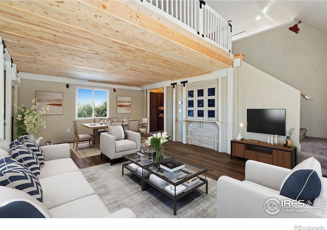 living room with hardwood / wood-style floors, wood ceiling, and a barn door