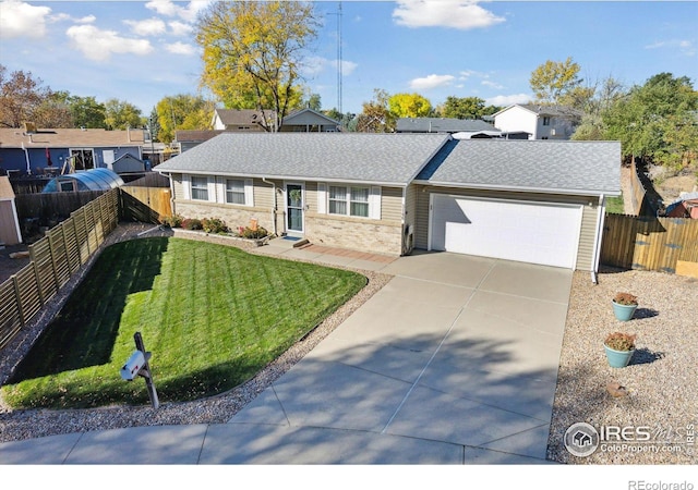 single story home with a garage and a front yard