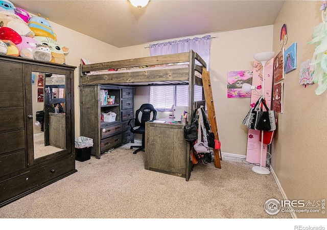 bedroom featuring light carpet