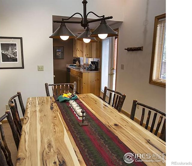 dining area featuring a chandelier