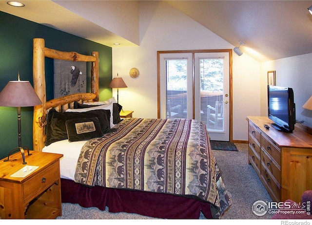 carpeted bedroom featuring lofted ceiling