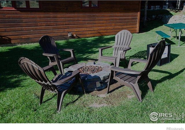 view of patio with an outdoor fire pit