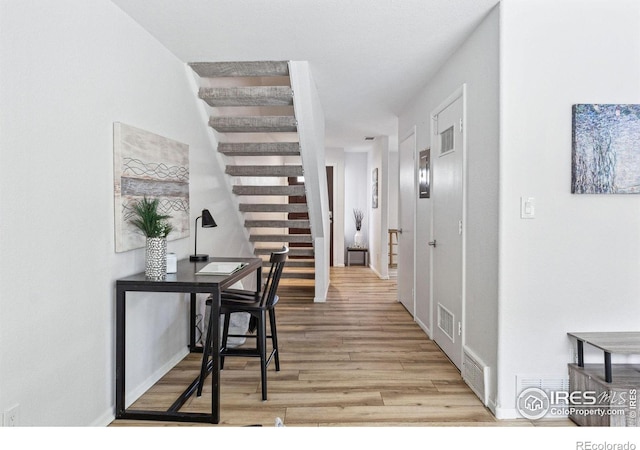 corridor featuring light hardwood / wood-style floors