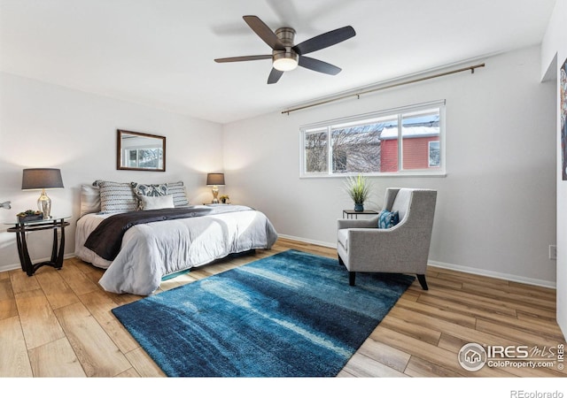 bedroom featuring hardwood / wood-style floors and ceiling fan