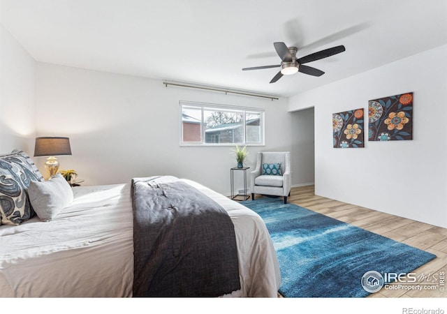 bedroom featuring hardwood / wood-style flooring and ceiling fan