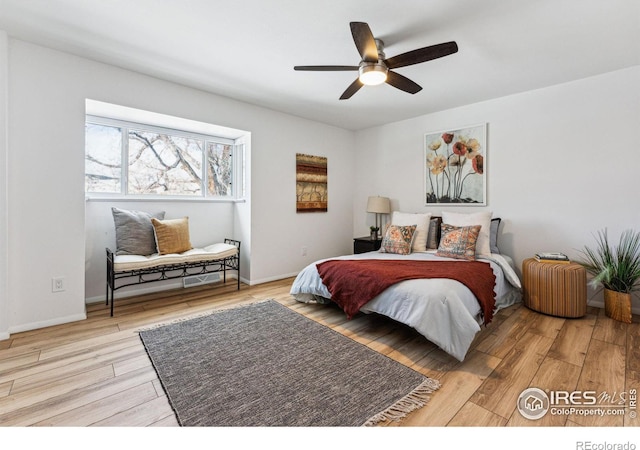 bedroom featuring ceiling fan and light hardwood / wood-style flooring