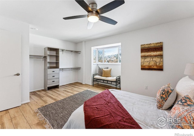 bedroom featuring light hardwood / wood-style floors, a closet, and ceiling fan