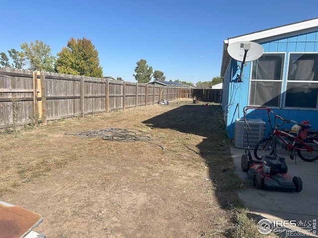 view of yard with central air condition unit