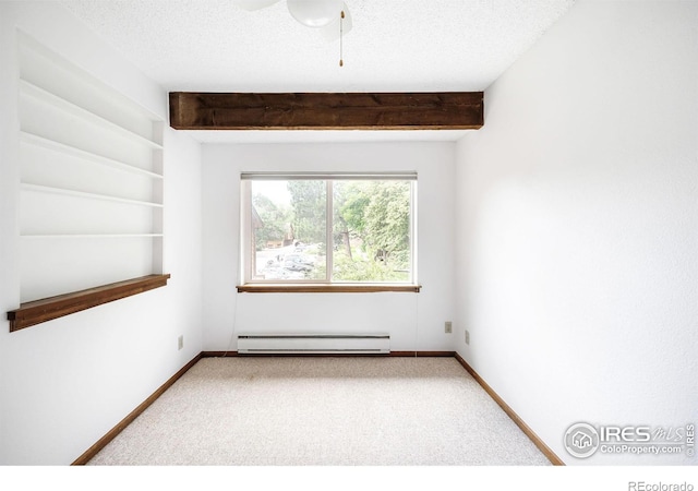 carpeted spare room featuring baseboard heating, ceiling fan, a textured ceiling, and beamed ceiling