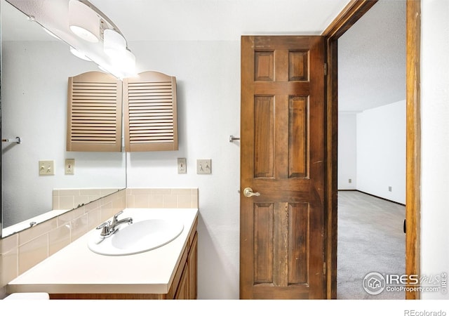 bathroom featuring vanity and a textured ceiling