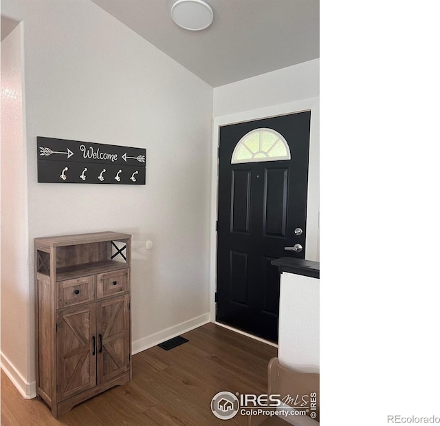 entryway with hardwood / wood-style flooring