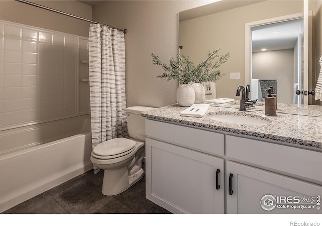 full bathroom featuring vanity, shower / bathtub combination with curtain, tile patterned floors, and toilet