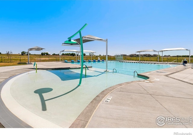 view of swimming pool featuring a patio