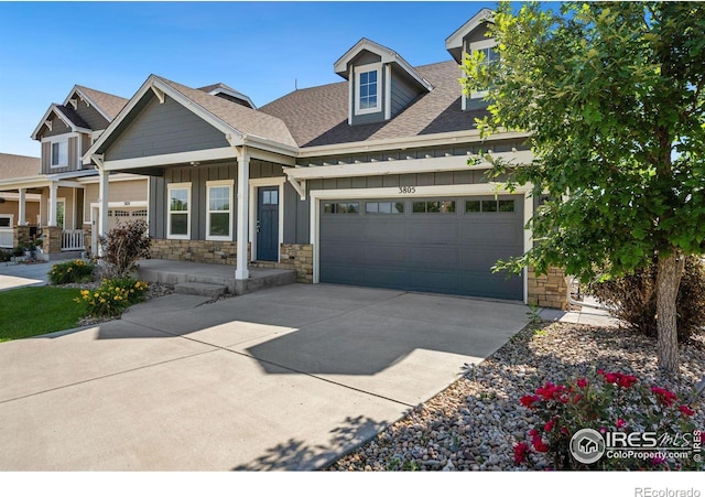 view of front of house featuring a porch and a garage