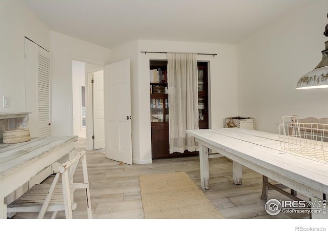 unfurnished dining area with light wood-type flooring