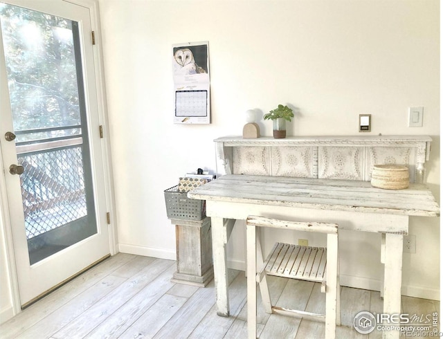 misc room featuring a healthy amount of sunlight and hardwood / wood-style floors