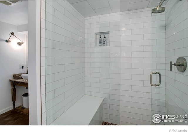 bathroom featuring a shower with shower door