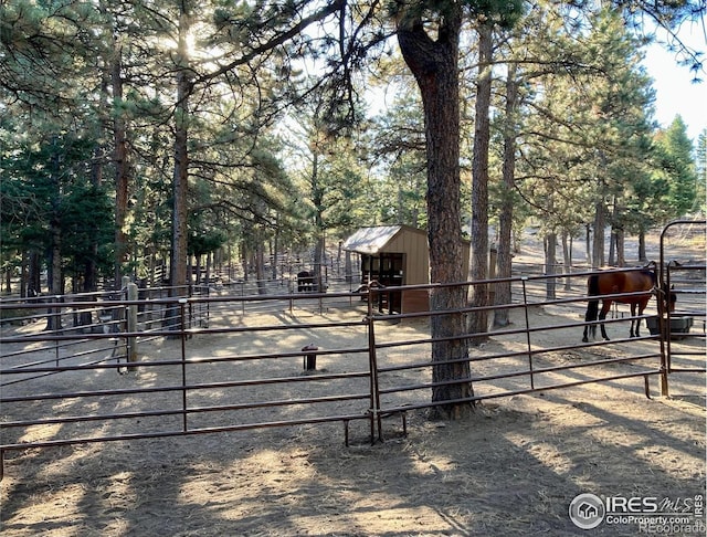 view of gate with an outdoor structure