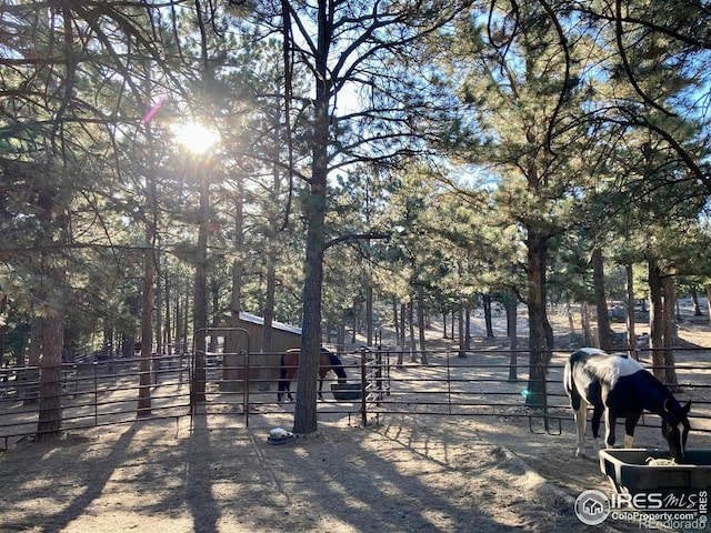 surrounding community with a rural view and an outdoor structure