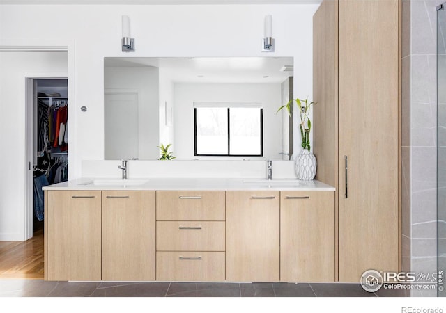 bathroom featuring vanity and hardwood / wood-style flooring