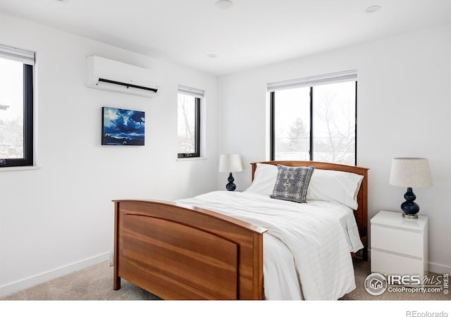 carpeted bedroom featuring an AC wall unit