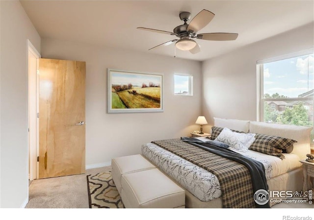 carpeted bedroom featuring ceiling fan