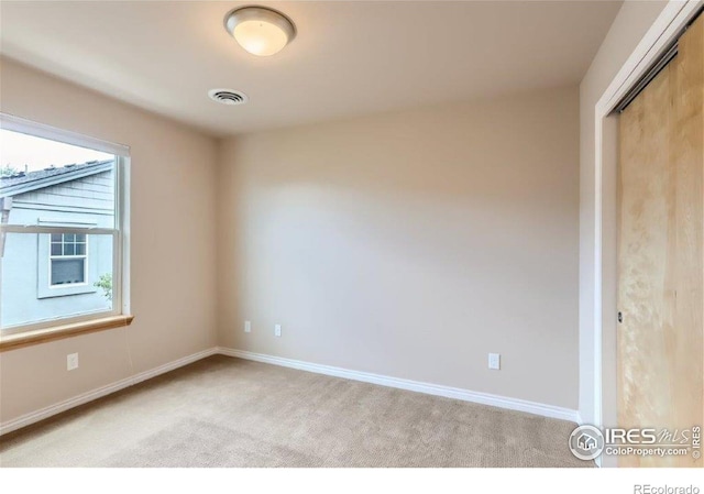 view of carpeted spare room