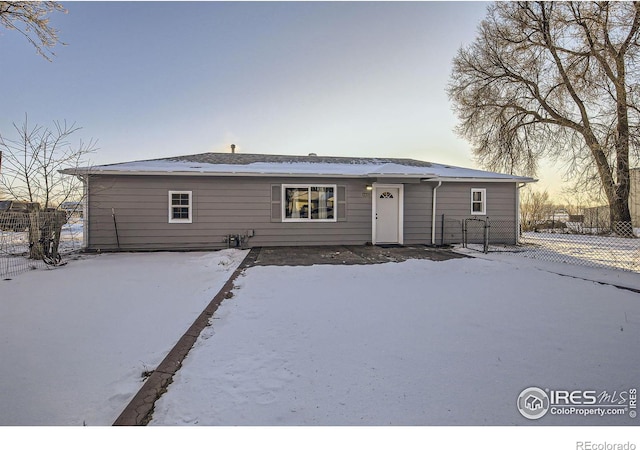 view of snow covered house