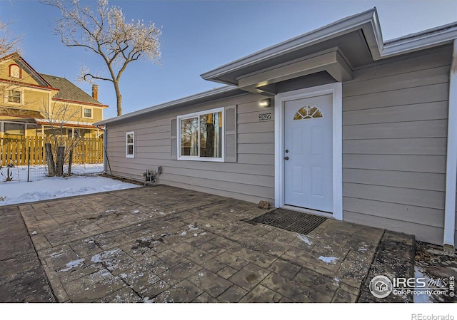 entrance to property with a patio area