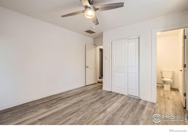 unfurnished bedroom with ceiling fan, light hardwood / wood-style floors, and a closet